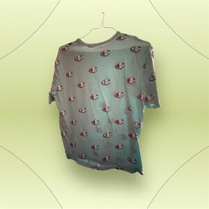 Champion All-Over Logo Tee in red and blue .